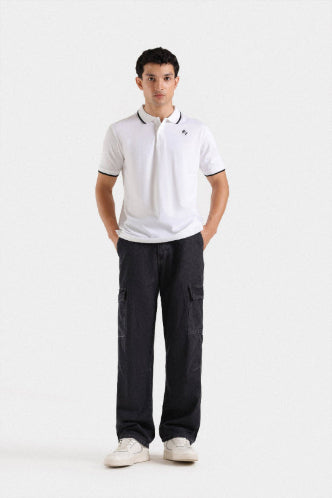 white polo shirt and dark cargo pants on a white background